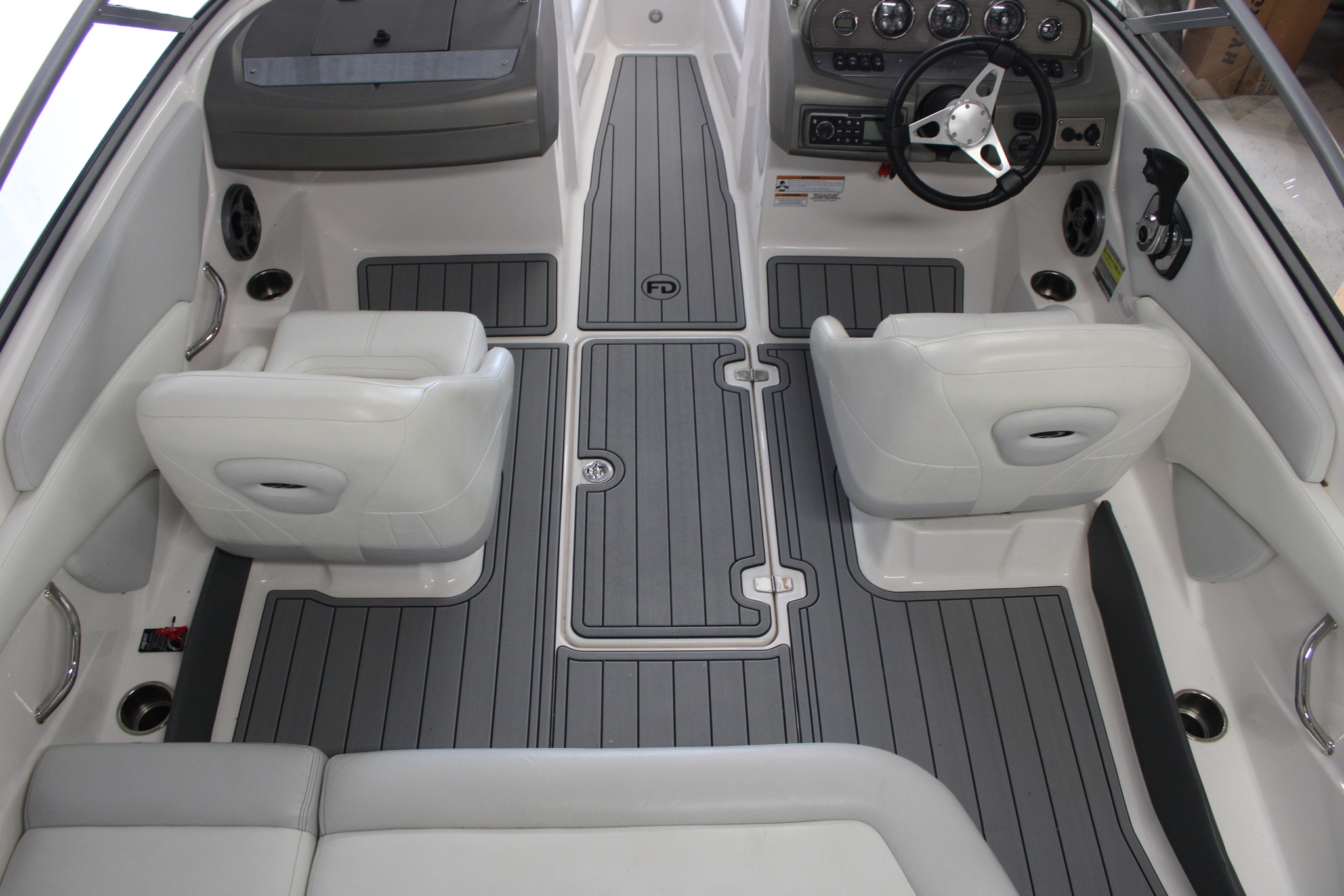 Storm gray over black FlexDek boat decking with routed teakline pattern