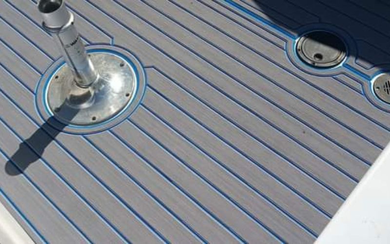 Storm gray FlexDek boat flooring with electric blue accents